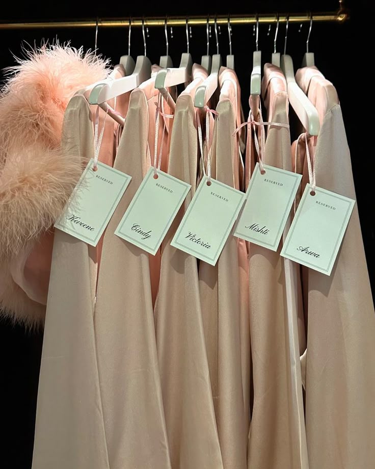 A row of blush bridesmaid dresses
